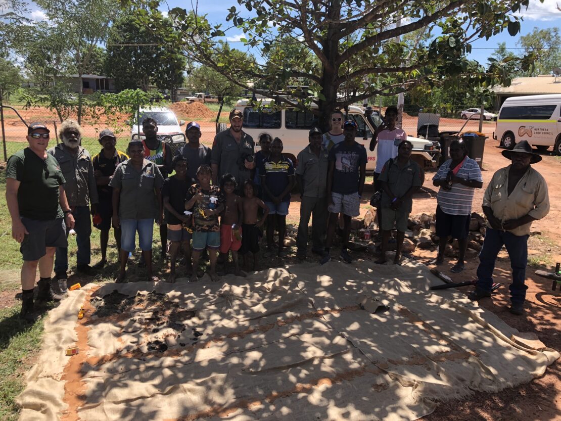 A group photo of North Australia Bushfire Solutions at a community fire training with the local community and Traditional Owners of the Land